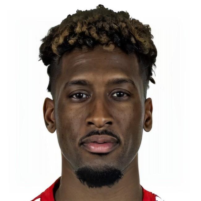 K. Coman