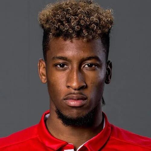K. Coman