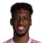 K. Coman
